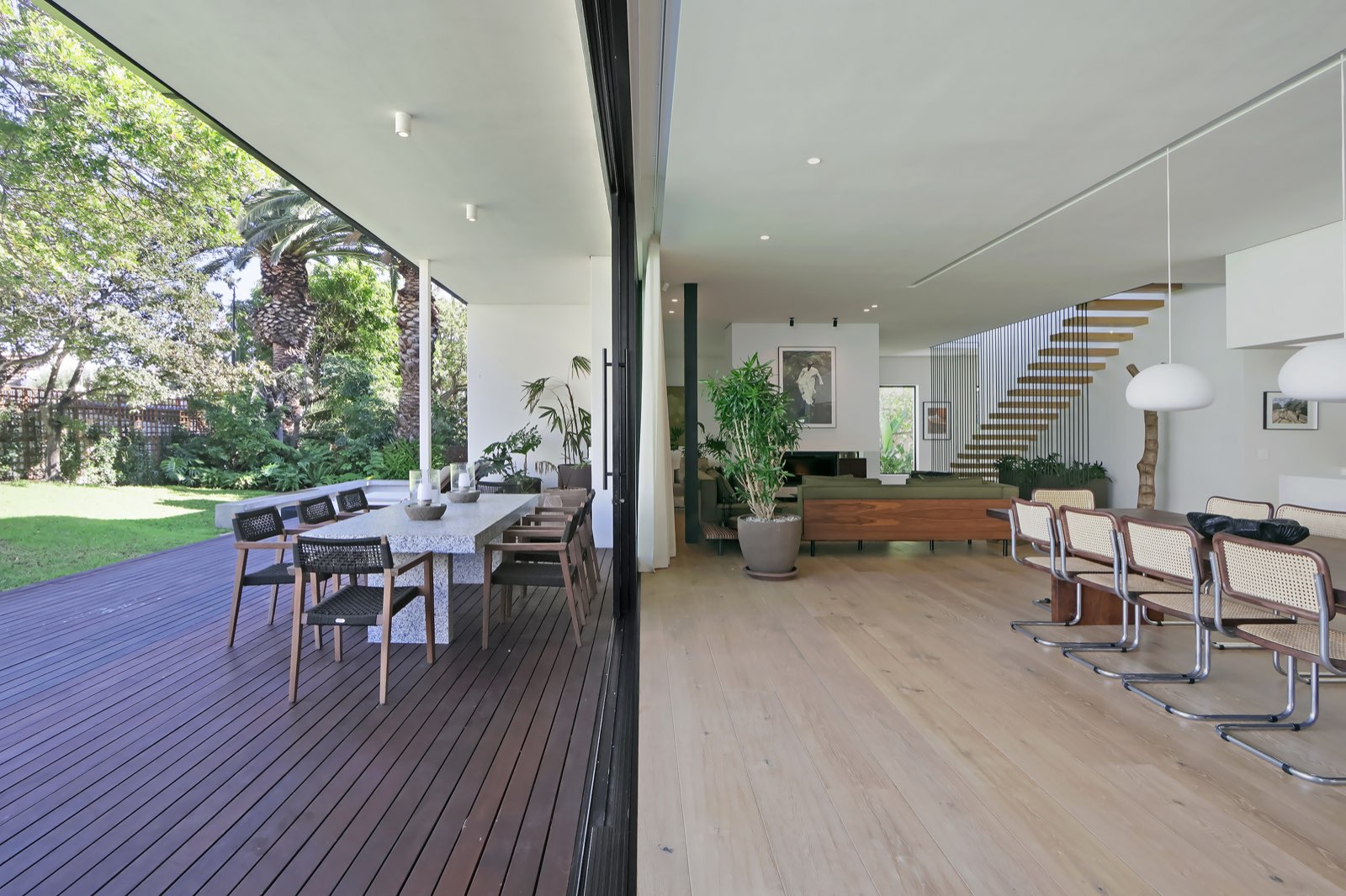 Indoor-outdoor transition — sliding glass doors open to garden