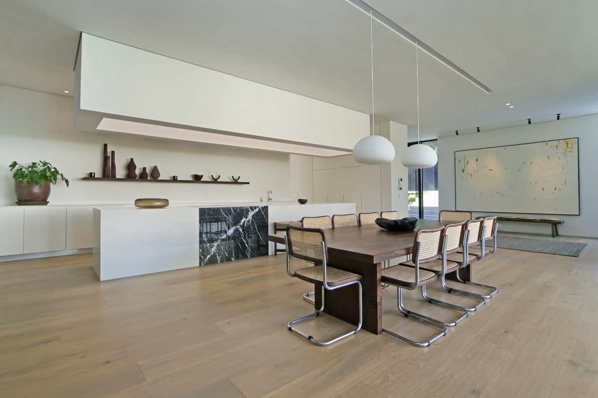 Dining area with Cesca chairs and marble backsplash