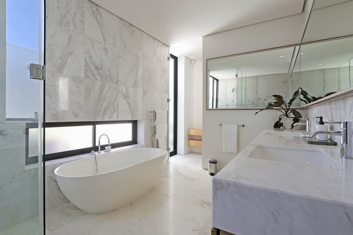 Marble bathroom with freestanding tub and double vanity